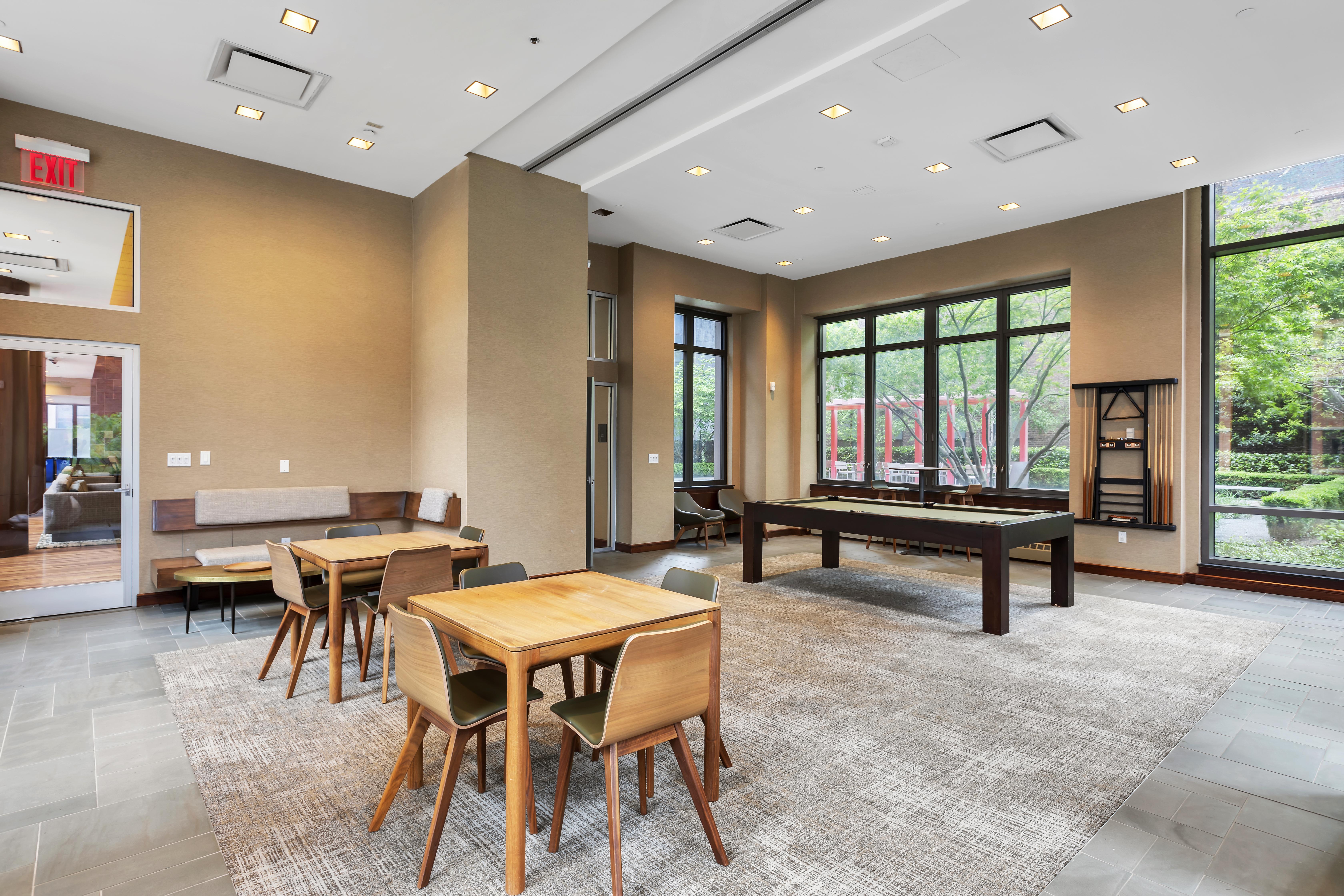 101 West 24th Street, Unit 26A Manhattan, NY 10011 - Photo 19 of 21 a living room with patio furniture and a large window