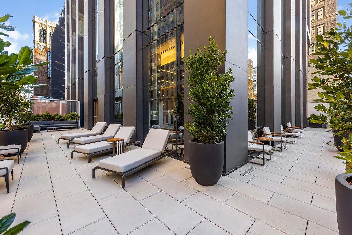 277 5th Avenue, Unit 21C Manhattan, NY 10016 - Photo 11 of 15 a view of a patio with couple of chairs and couch