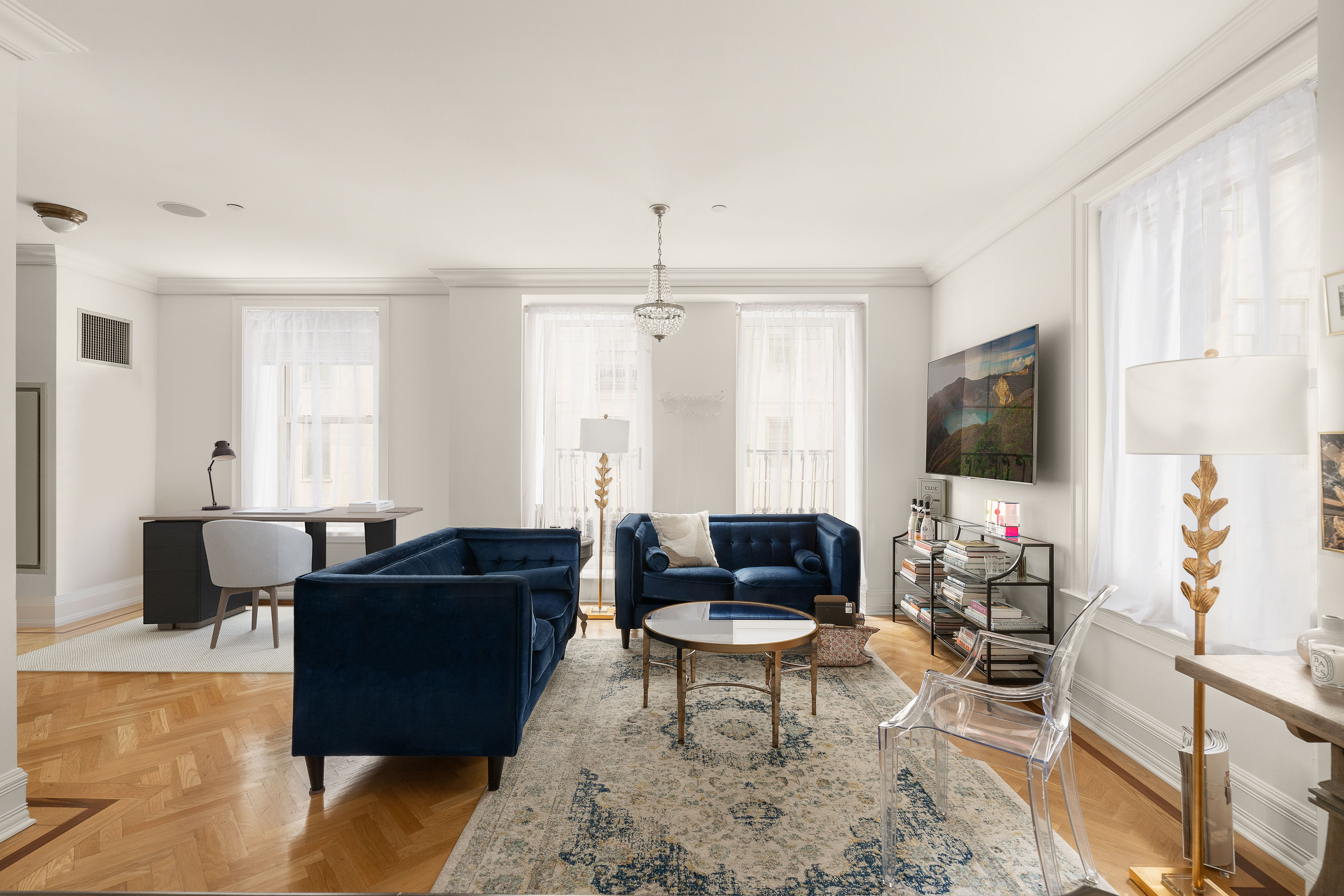 1 Central Park South, Unit 1804 Manhattan, NY 10019 - Photo 5 of 23 a living room with furniture and a flat screen tv