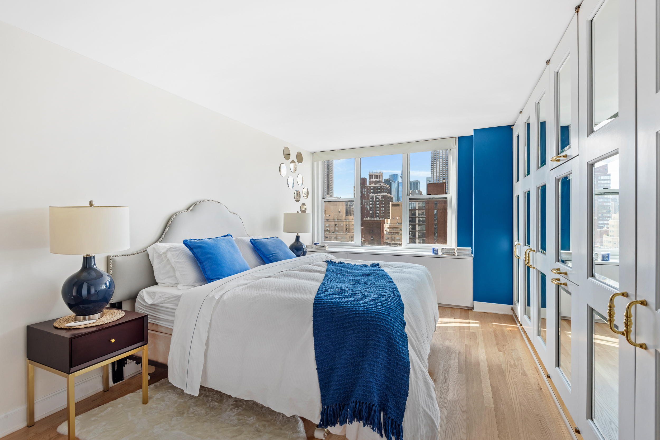 137 East 36th Street, Unit 21F Manhattan, NY 10016 - Photo 9 of 18 a bedroom with a bed and a large window