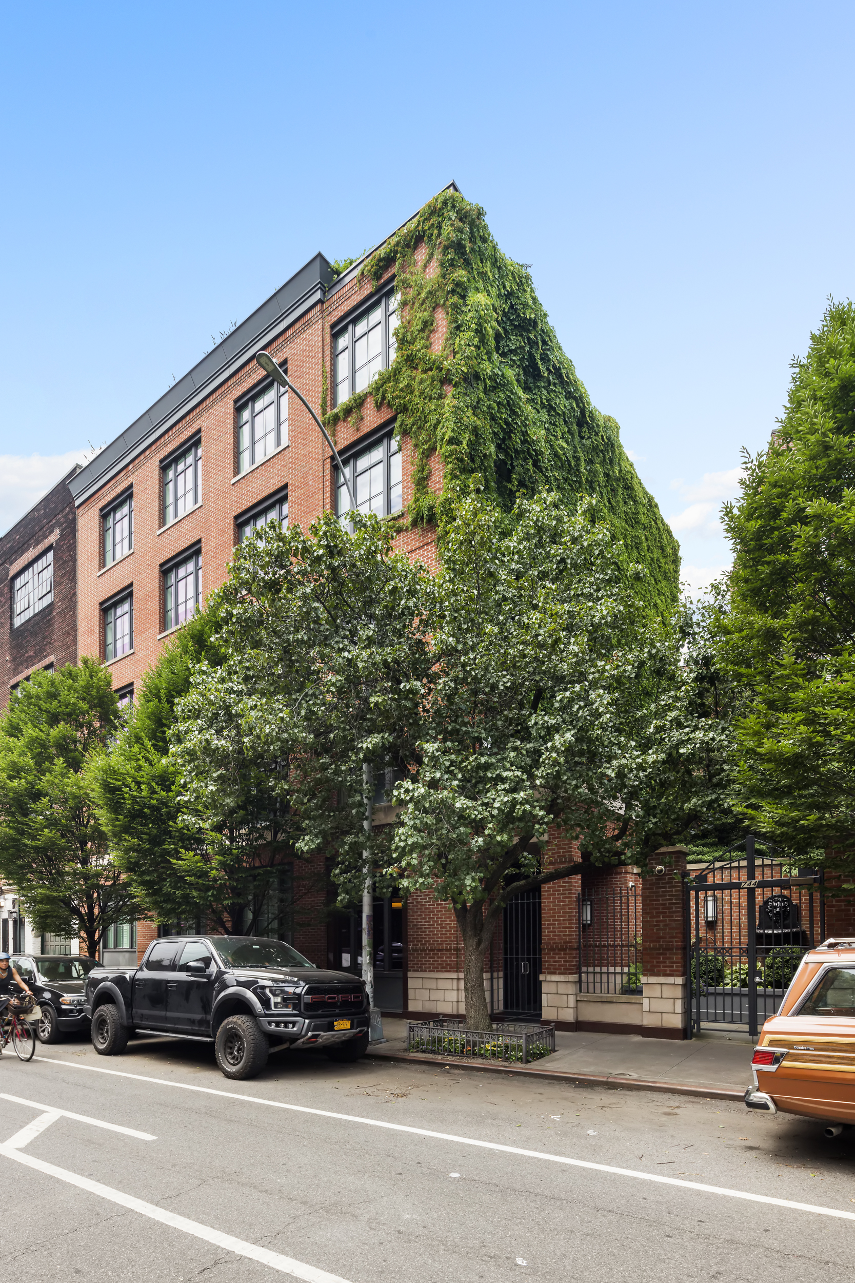744 Greenwich Street, Unit 4 Manhattan, NY 10014 - Photo 33 of 34 a view of a cars parked in front of a building