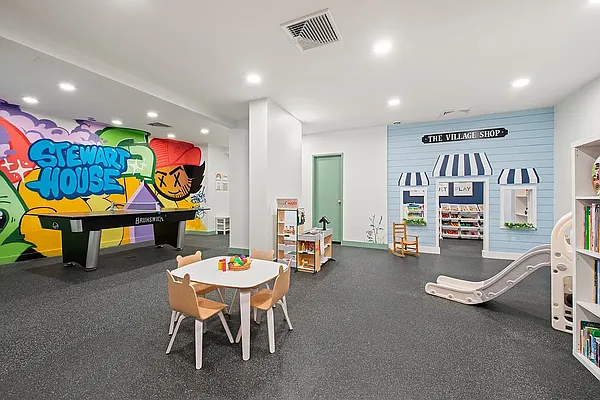 70 East 10th Street, Unit 14M Manhattan, NY 10003 - Photo 20 of 22 a room with furniture and air hockey table