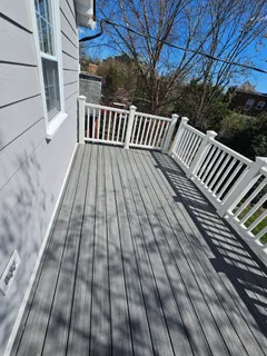 a view of balcony with wooden floor