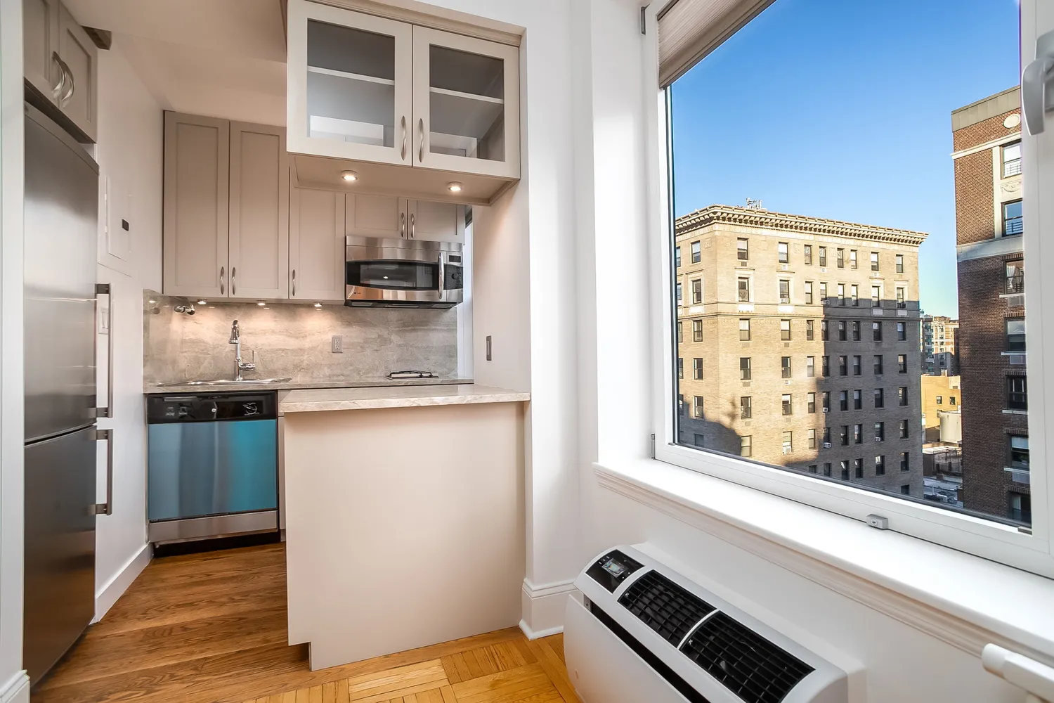 a kitchen with stainless steel appliances granite countertop a stove and a refrigerator