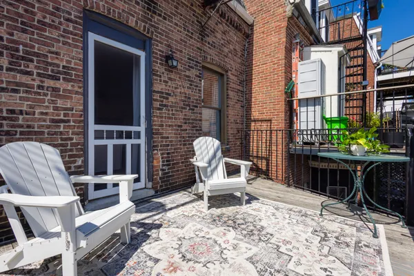 a chairs and a table in a patio