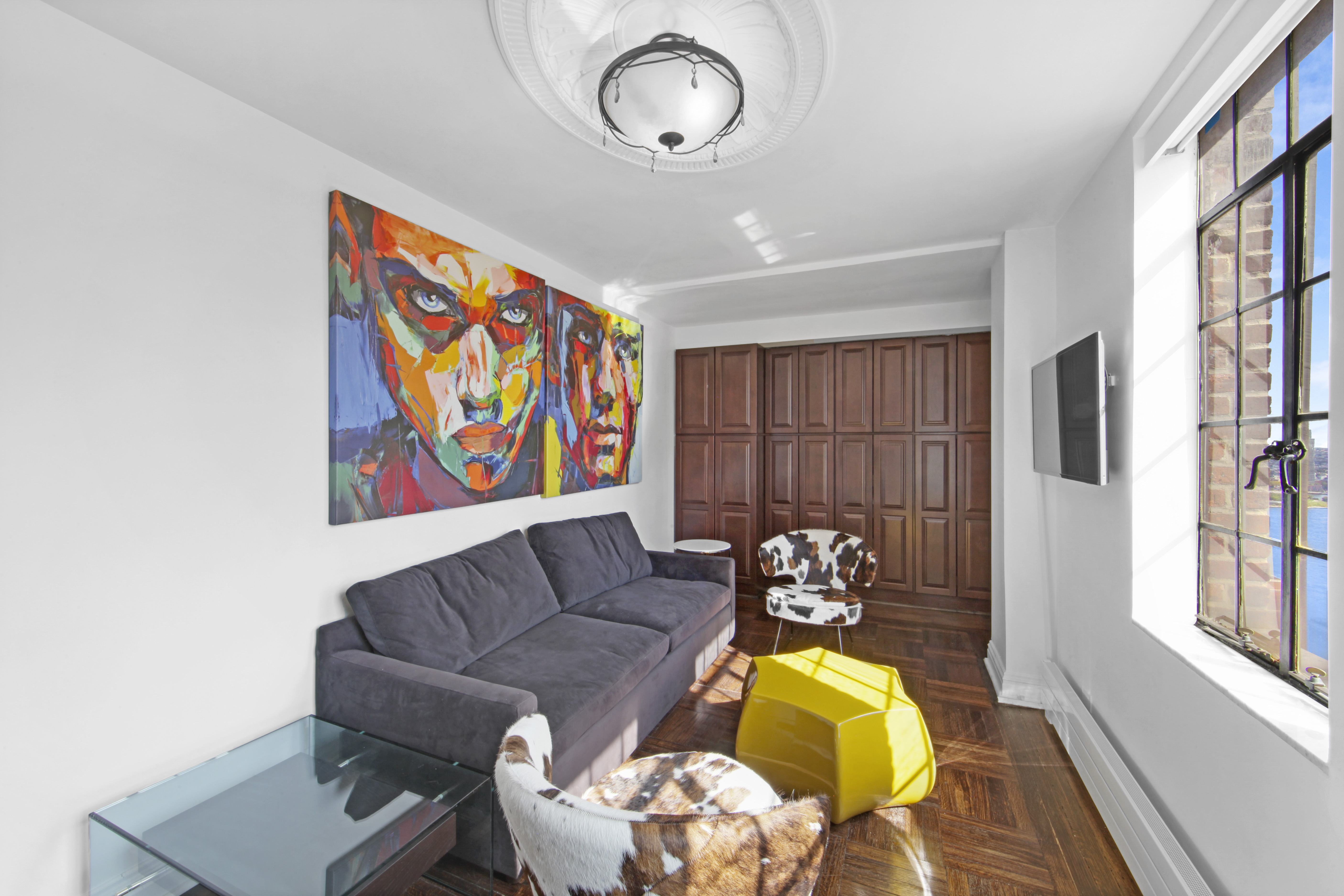 320 East 42nd Street, Unit 3012 Manhattan, NY 10017 - Photo 2 of 12 a living room with furniture and a window