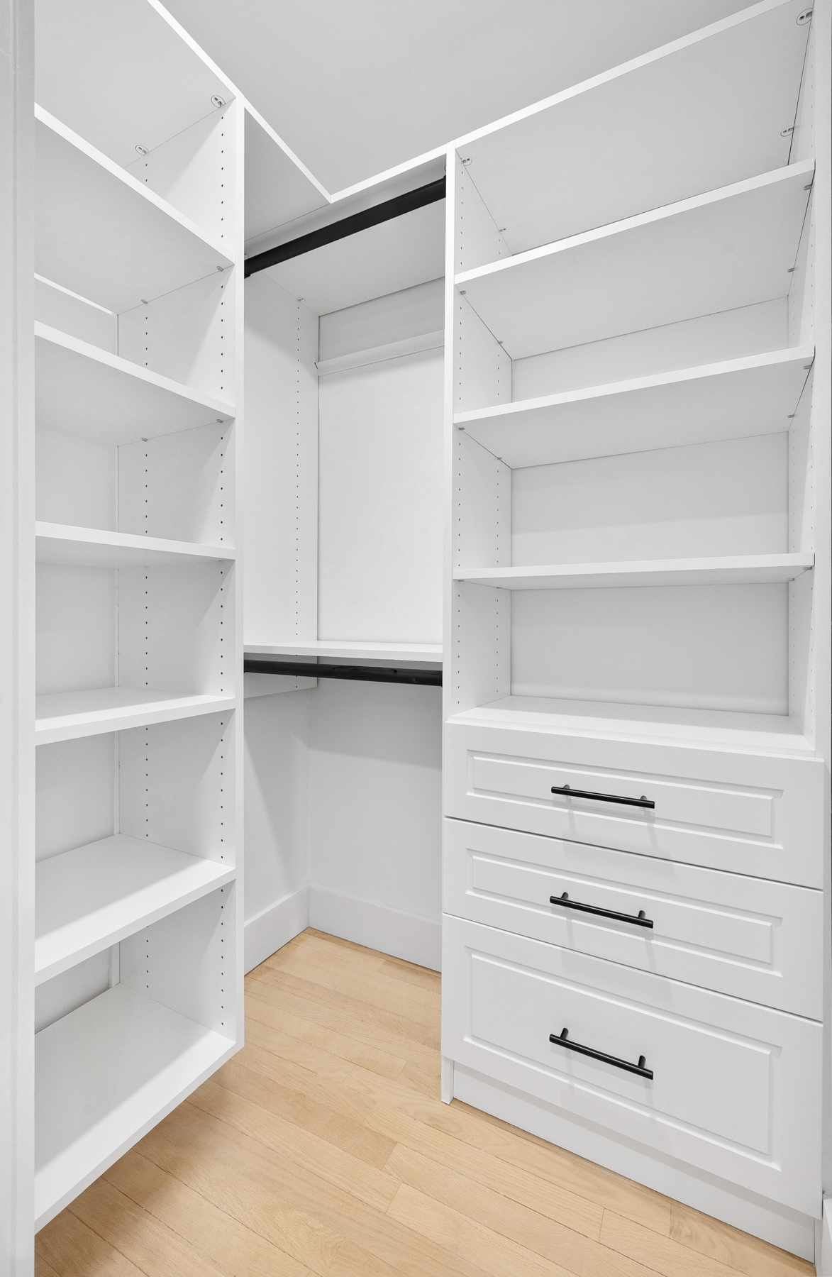 184 Thompson Street, Unit 2V Manhattan, NY 10012 - Photo 6 of 8 a view of walk in closet with empty racks