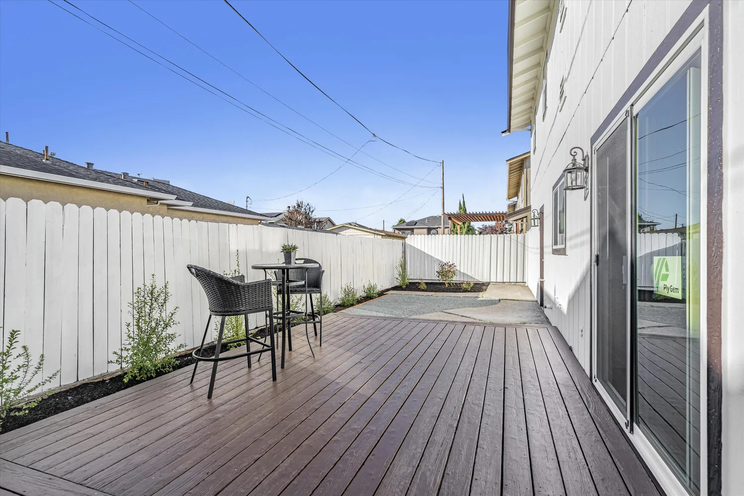 a view of a backyard with a white house