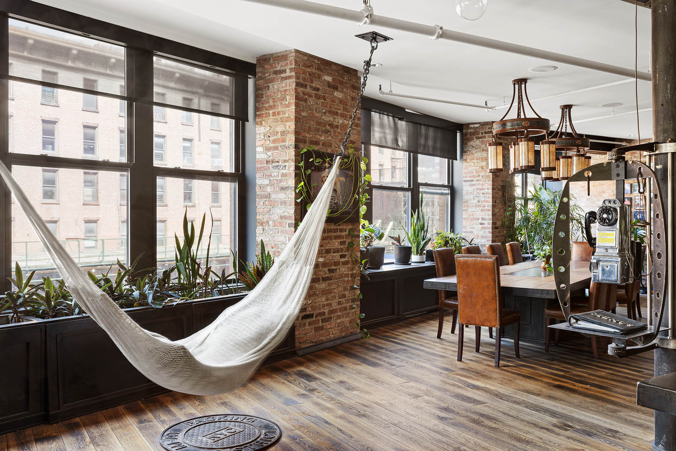 345 West 13th Street, Unit 2DEG Manhattan, NY 10014 - Photo 7 of 14 a living room with furniture large windows and wooden floor