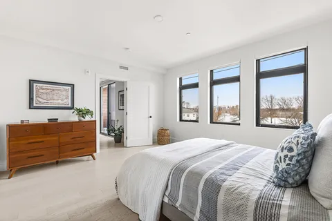 a bed room with a bed and a window