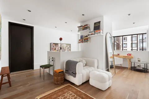a living room with furniture and a table