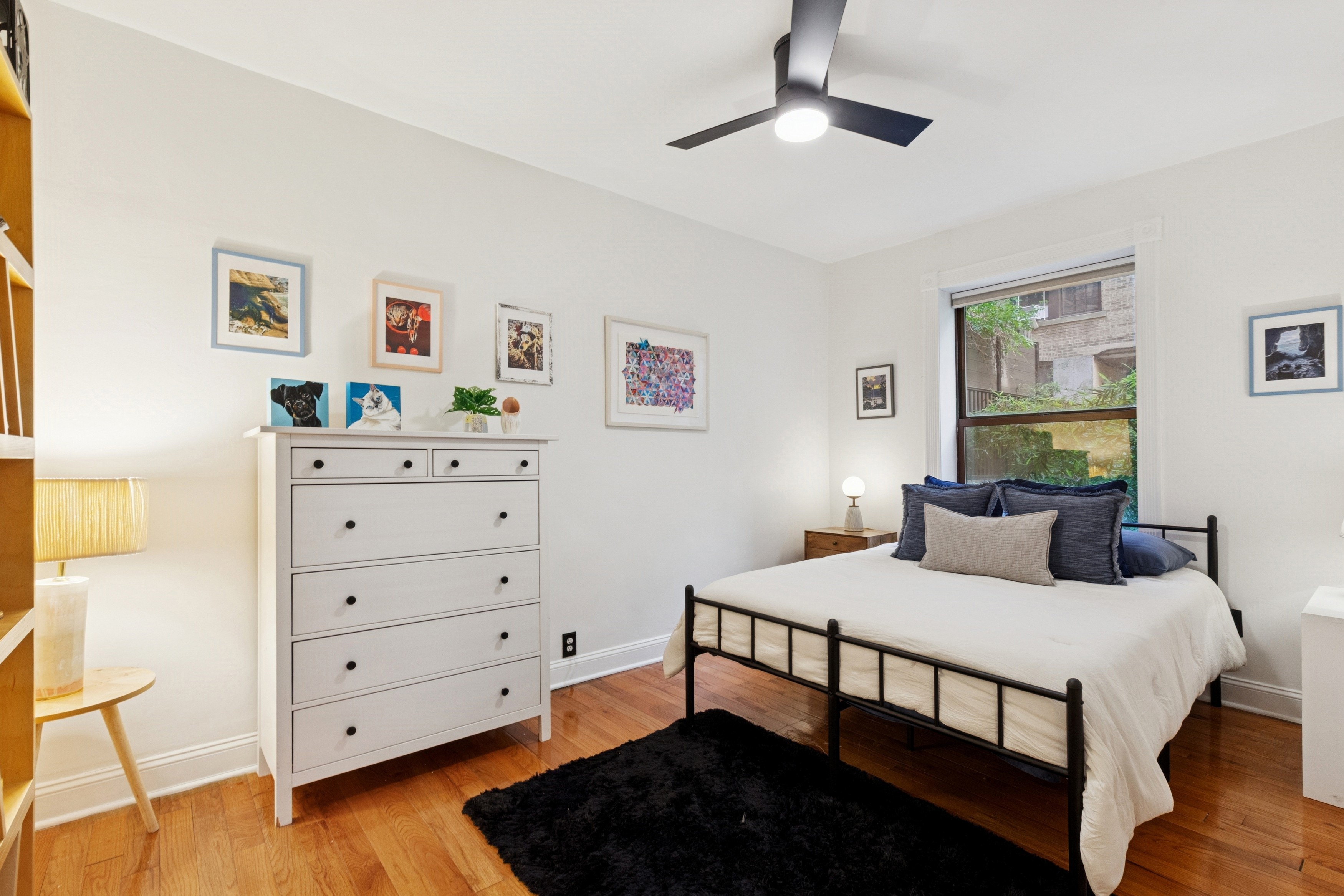 870 West 181st Street, Unit 2A Manhattan, NY 10033 - Photo 4 of 9 a bedroom with a bed and a dresser