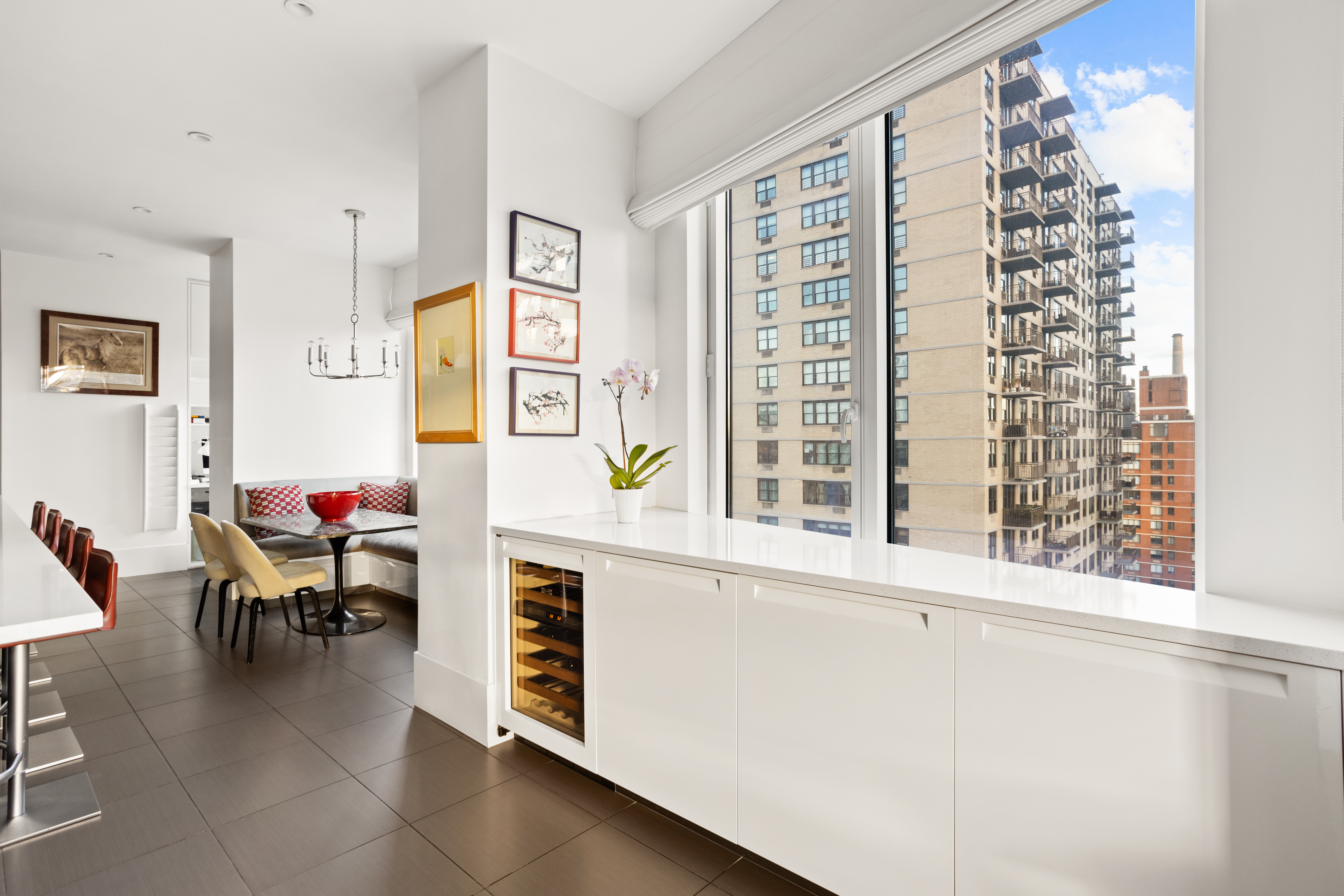 255 East 74th Street, Unit 21AB Manhattan, NY 10021 - Photo 4 of 37 a living room with furniture and a window