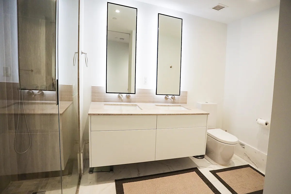 429 Kent Avenue, Unit D722 Brooklyn, NY 11249 - Photo 8 of 18 a bathroom with a sink and a mirror