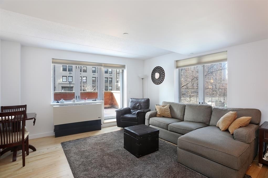 53 Boerum Place, Unit 2J Brooklyn, NY 11201 - Photo 1 of 9 a living room with furniture and a window