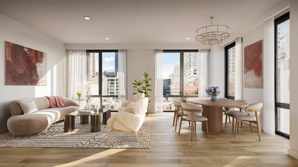 a living room with furniture wooden floor and a large window
