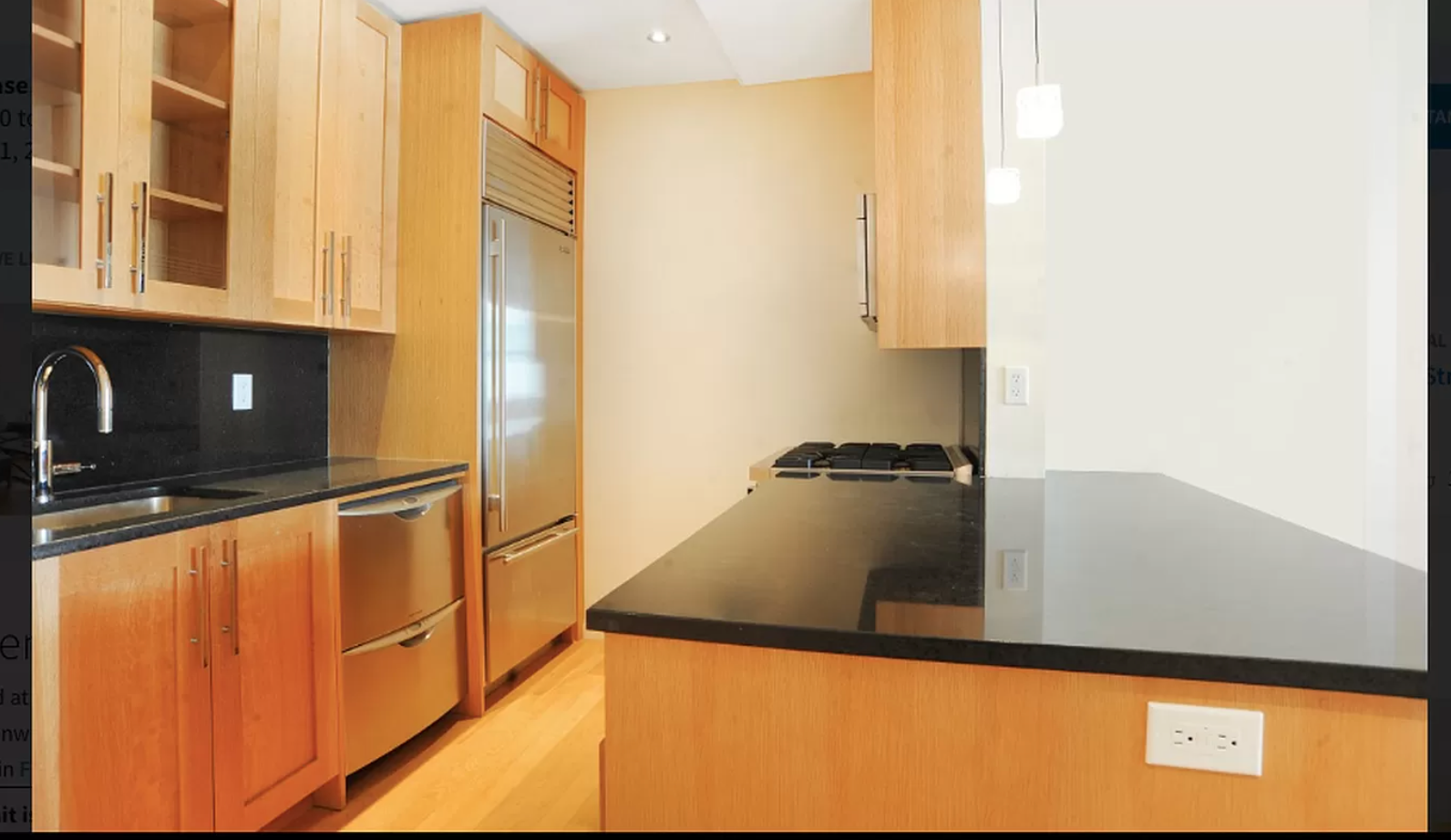88 Greenwich Street, Unit 821 Manhattan, NY 10006 - Photo 4 of 10 a view of a kitchen with a sink and cabinets