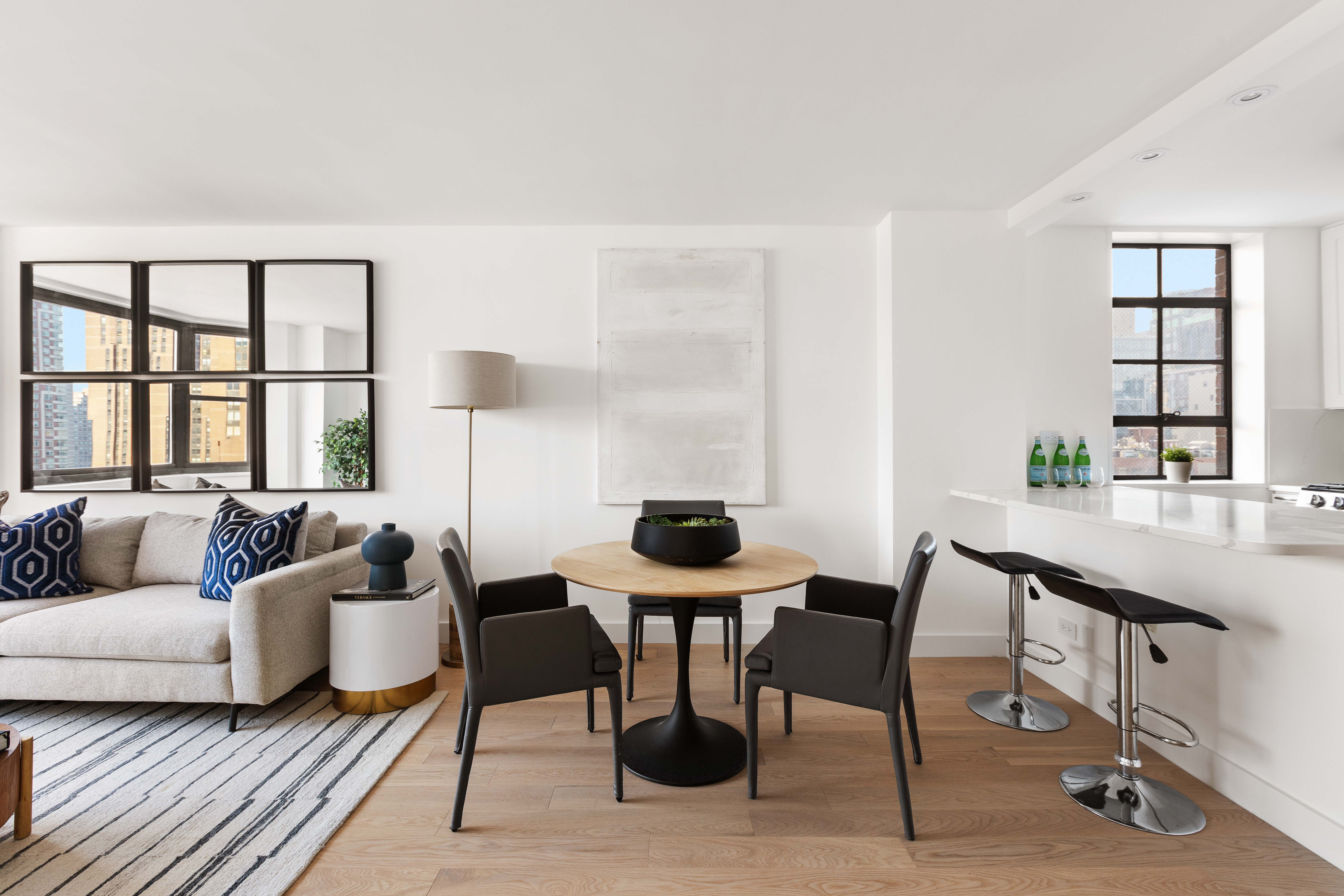 200 East 90th Street, Unit 12F Manhattan, NY 10128 - Photo 3 of 13 a living room with furniture and a window