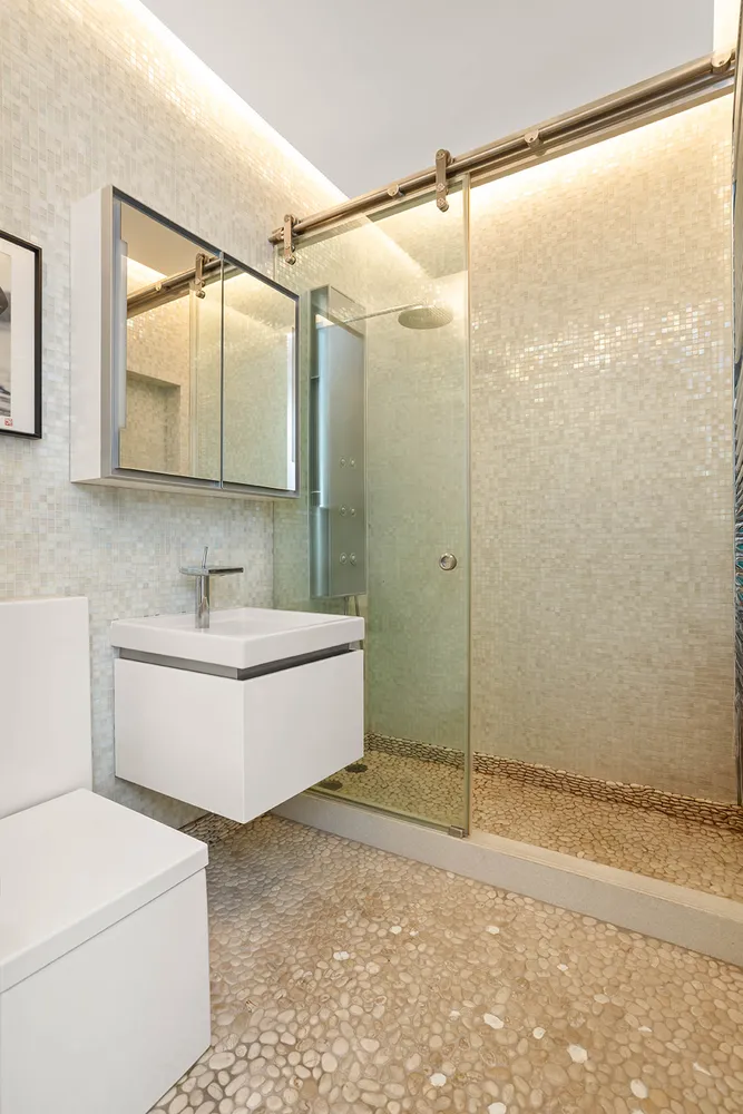 a bathroom with a bathtub and a shower