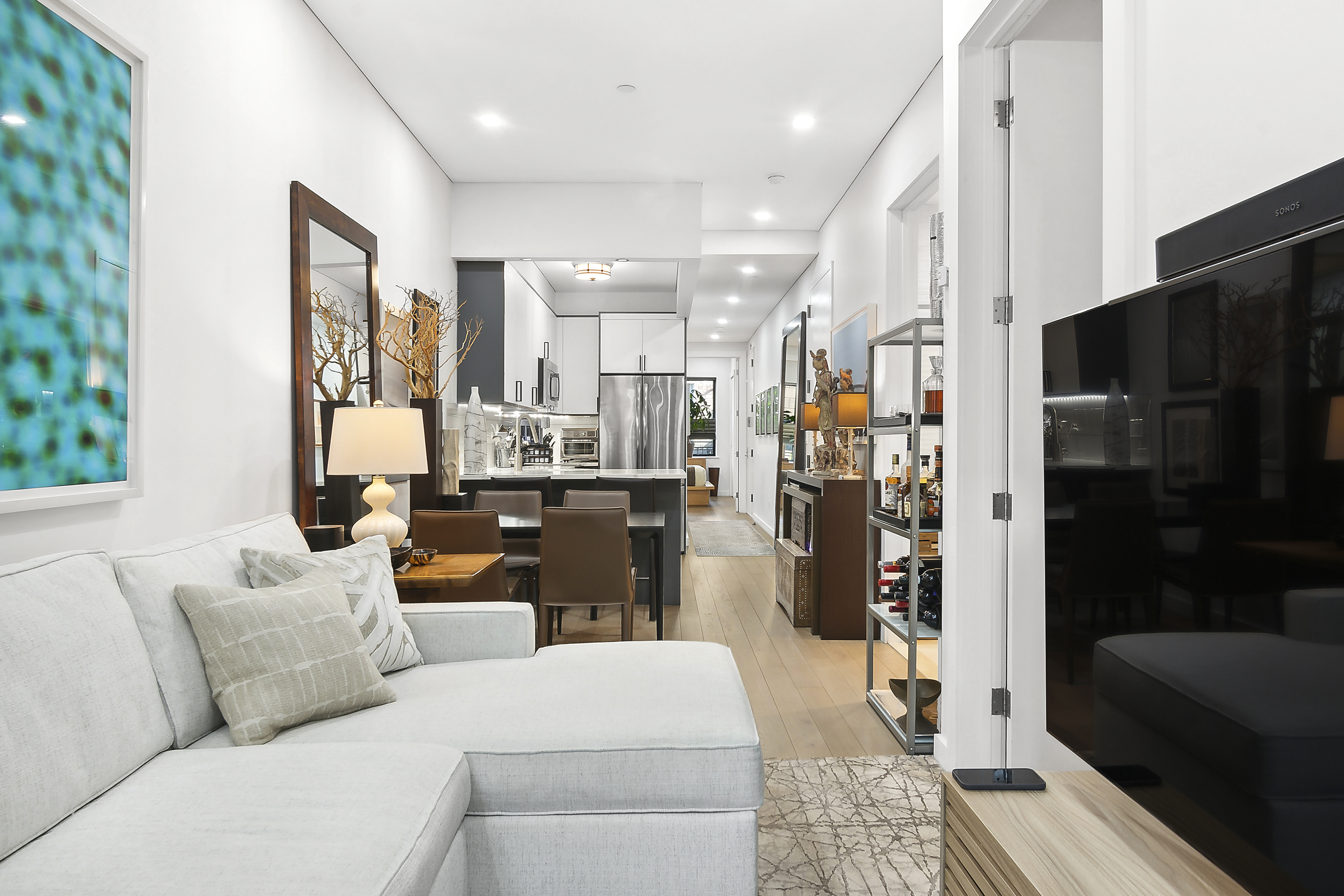 1043 Halsey Street, Unit 1 Brooklyn, NY 11207 - Photo 7 of 14 a living room with furniture and a rug