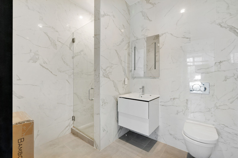 100 2nd Avenue, Unit 2 Manhattan, NY 10003 - Photo 10 of 10 a bathroom with a toilet sink and shower