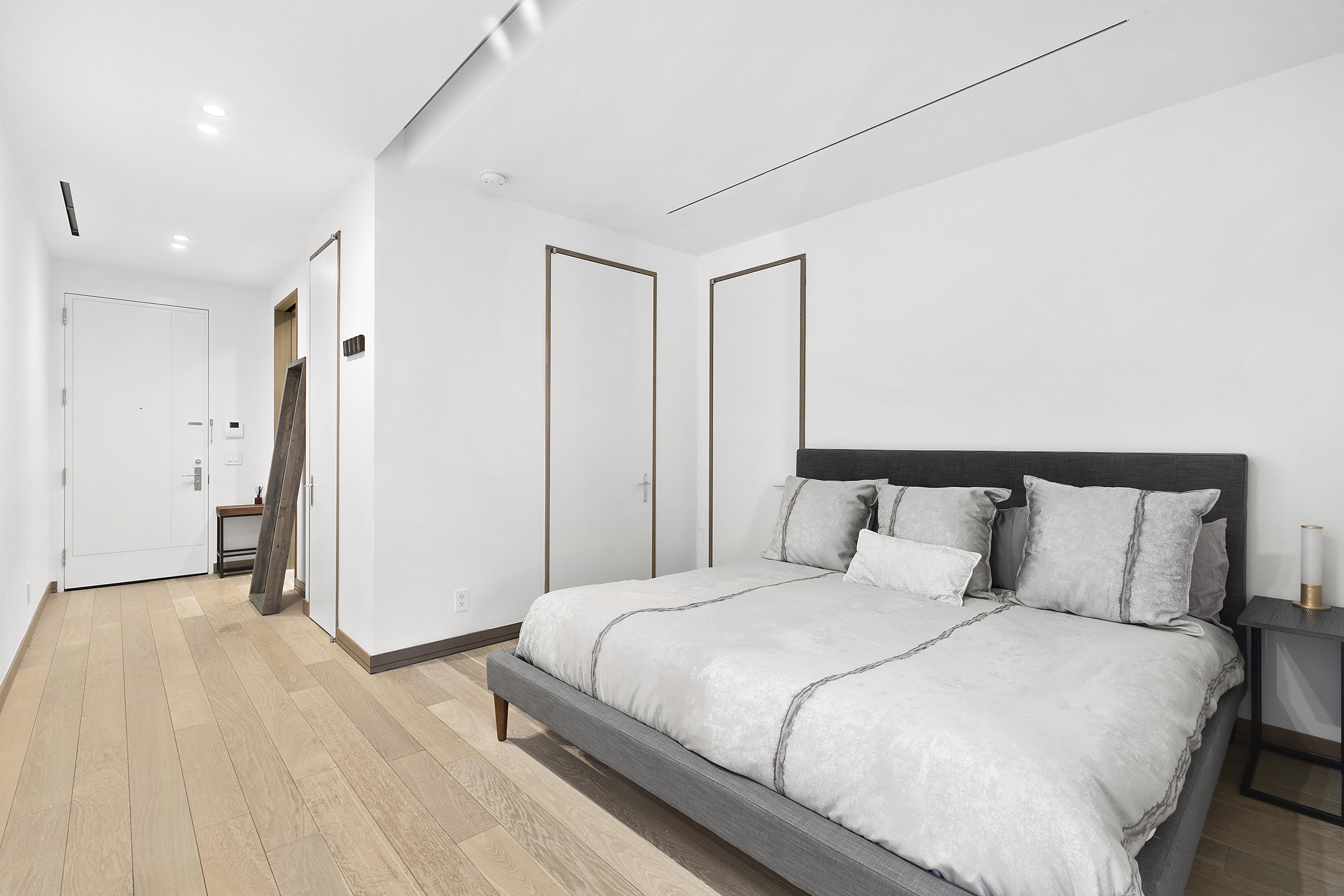 88 Lexington Avenue, Unit 802 Manhattan, NY 10016 - Photo 5 of 22 a bedroom with a bed and a walk in closet