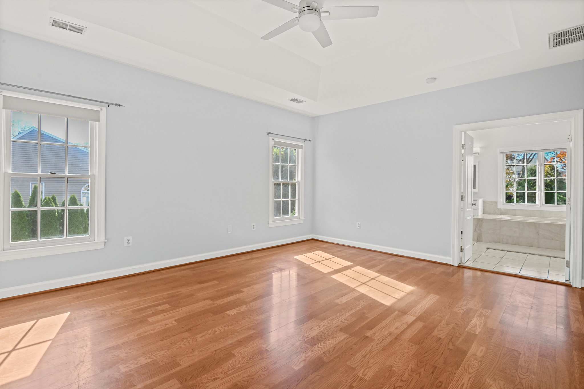 2628 Five Oaks Road Vienna, VA 22181 - Photo 20 of 40 a view of an empty room with a window and wooden floor