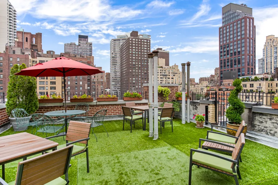 a swimming pool with outdoor seating and yard