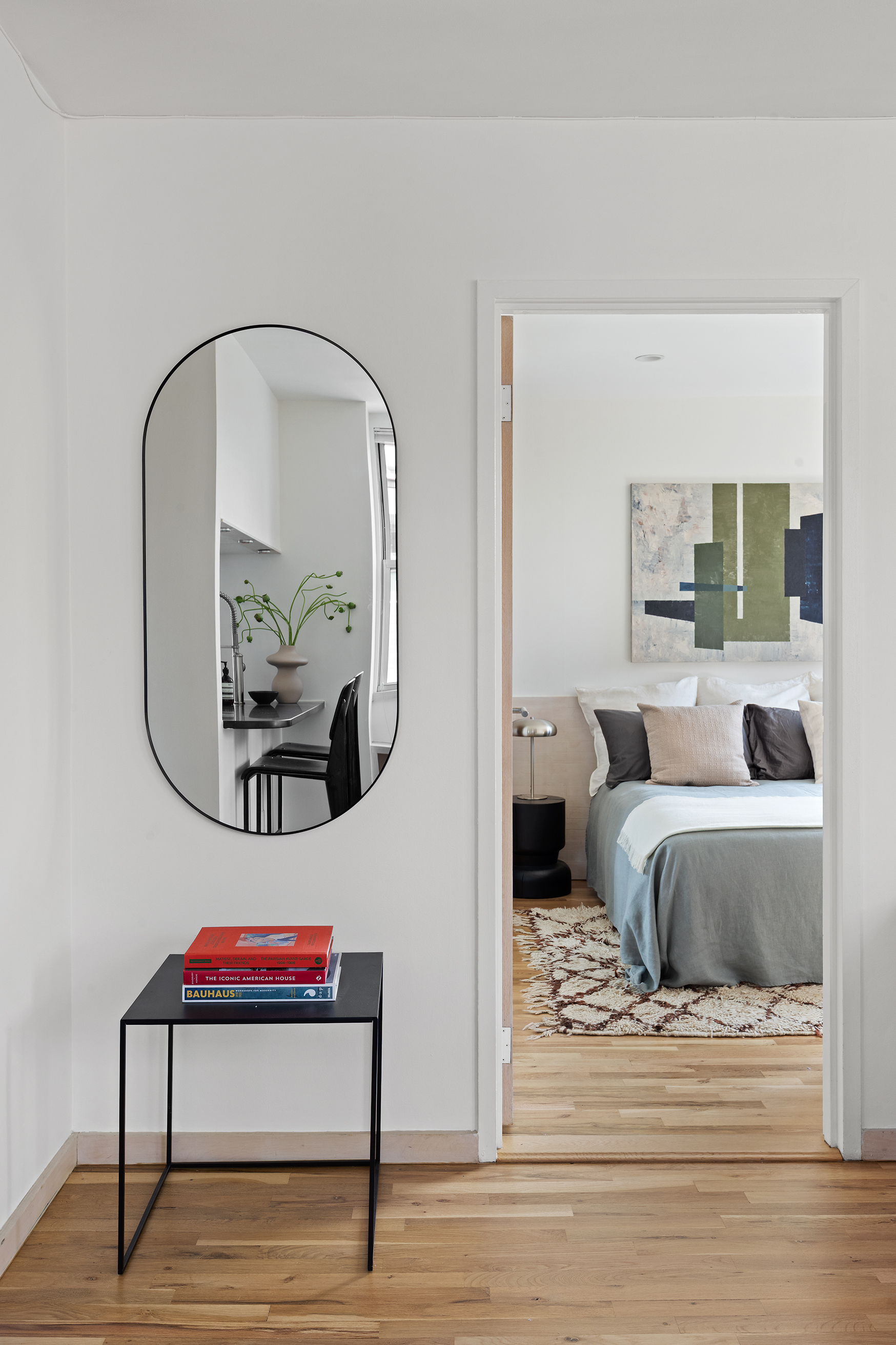 350 West 14th Street, Unit 6D Manhattan, NY 10014 - Photo 8 of 16 a living room with furniture and a mirror