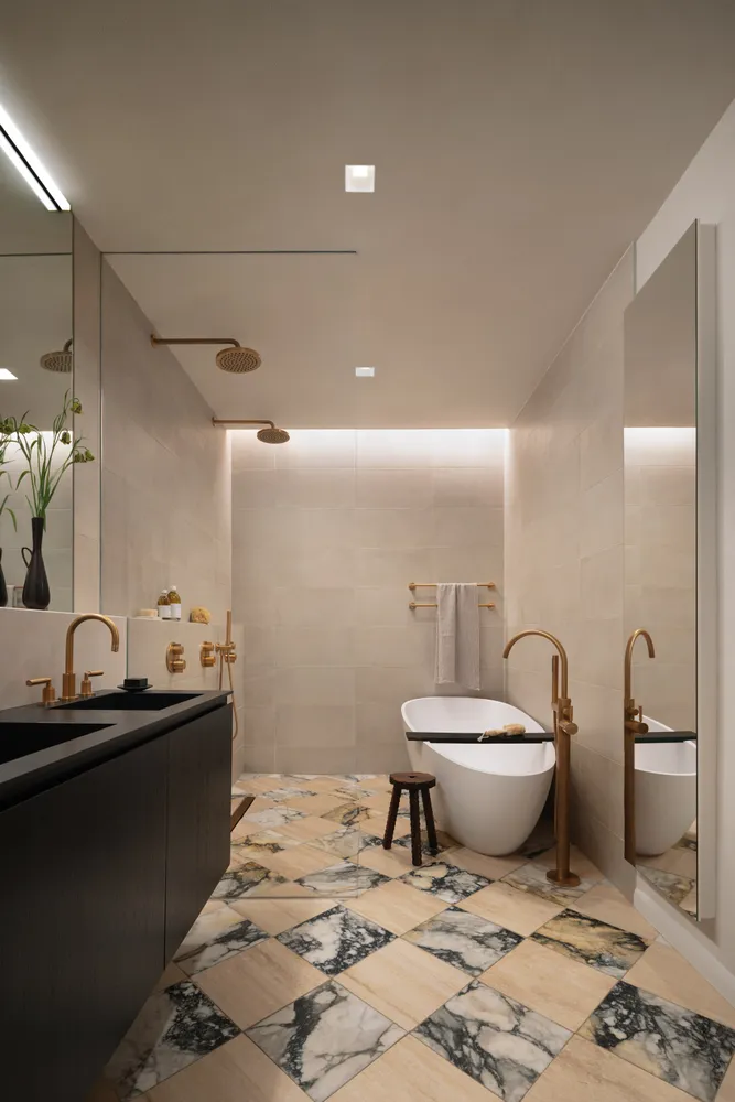 a bathroom with a granite countertop sink a toilet and a mirror