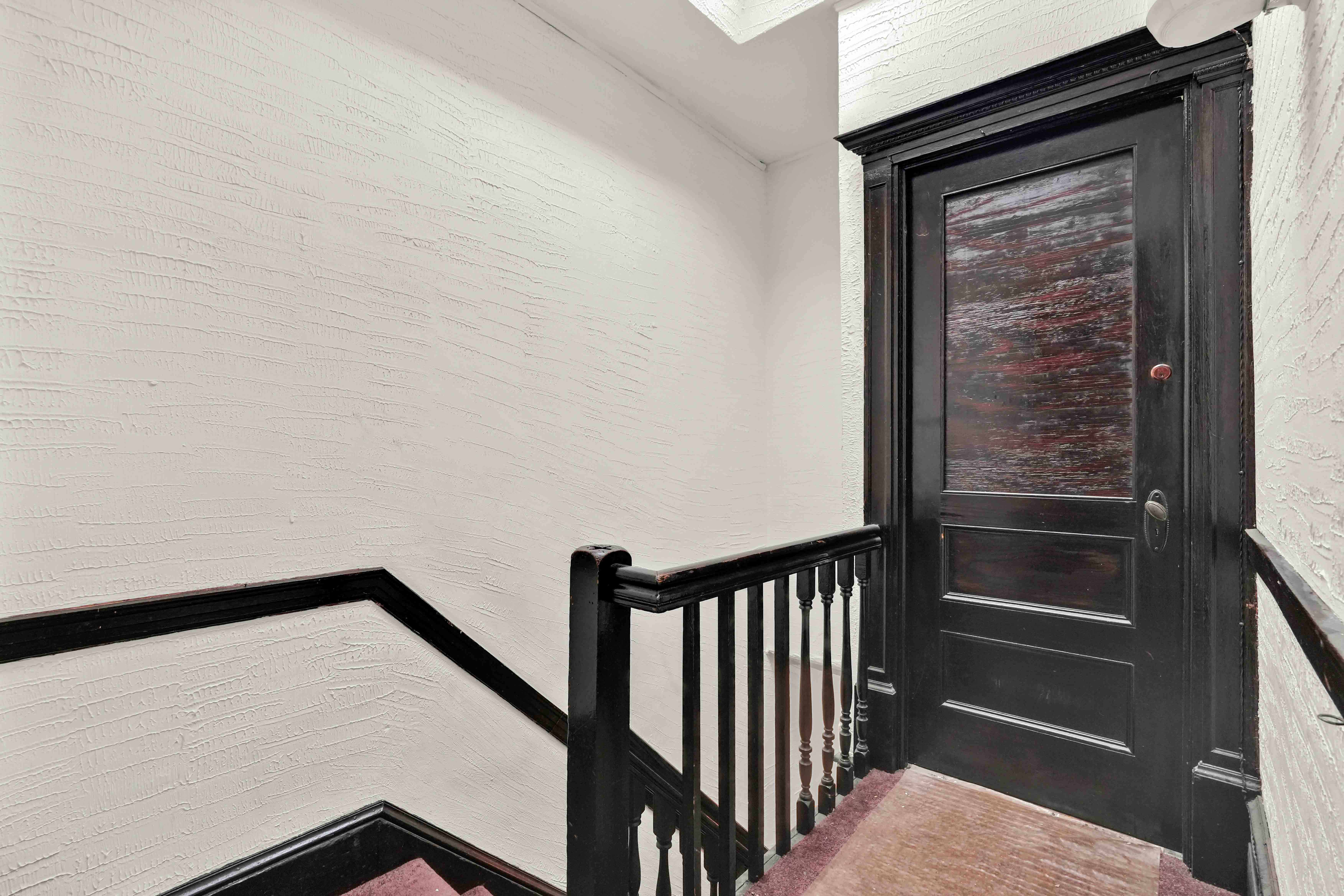278 Lefferts Avenue Brooklyn, NY 11225 - Photo 21 of 56 a view of a hallway with wooden floor and staircase