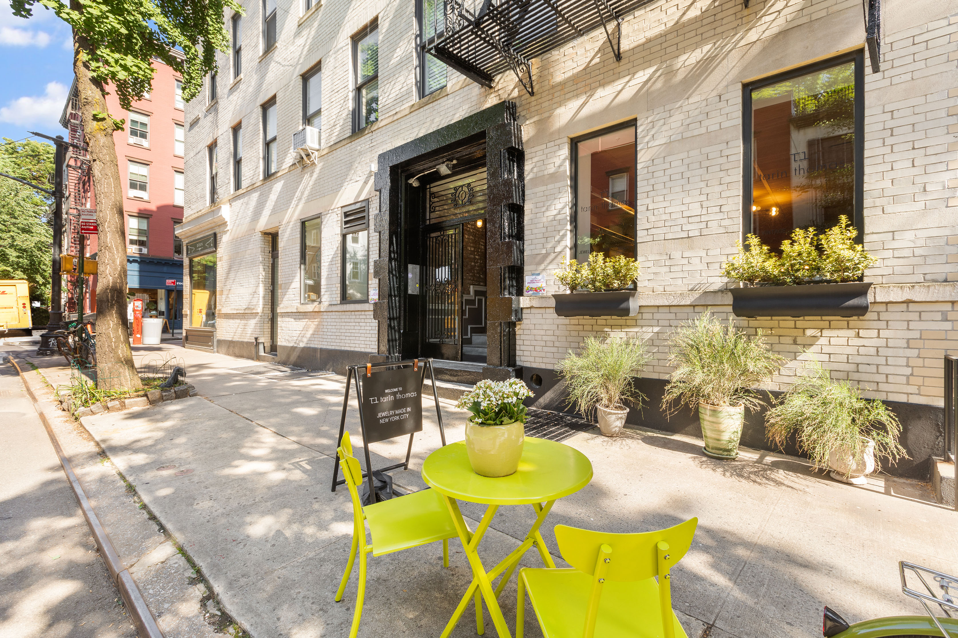 92 Perry Street, Unit 6 Manhattan, NY 10014 - Photo 9 of 10 a view of a patio with couches table and chairs and potted plants
