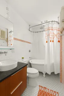 a bathroom with a sink a toilet and a bathtub