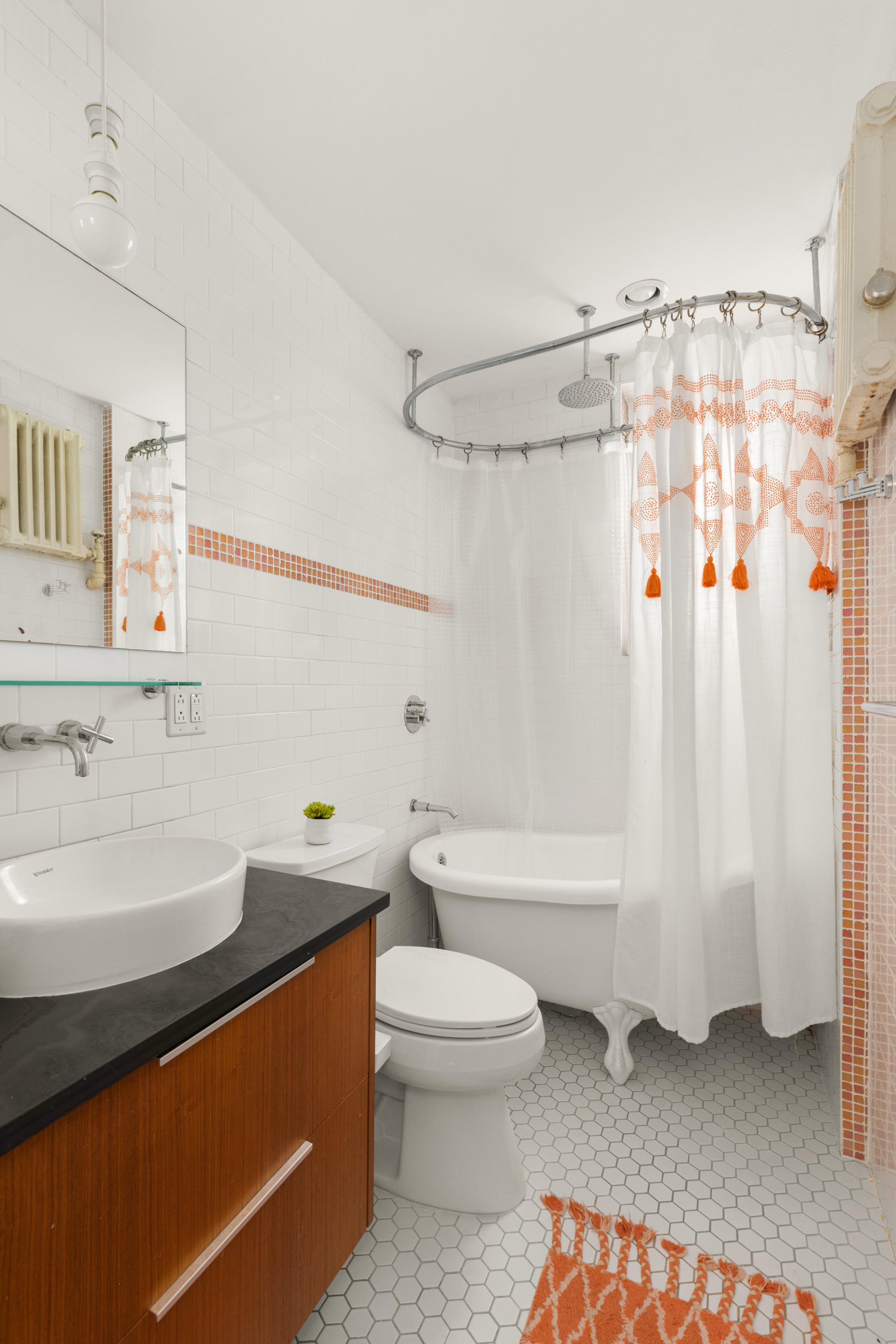 345 Montgomery Street, Unit 1N Brooklyn, NY 11225 - Photo 5 of 7 a bathroom with a sink a toilet and a bathtub