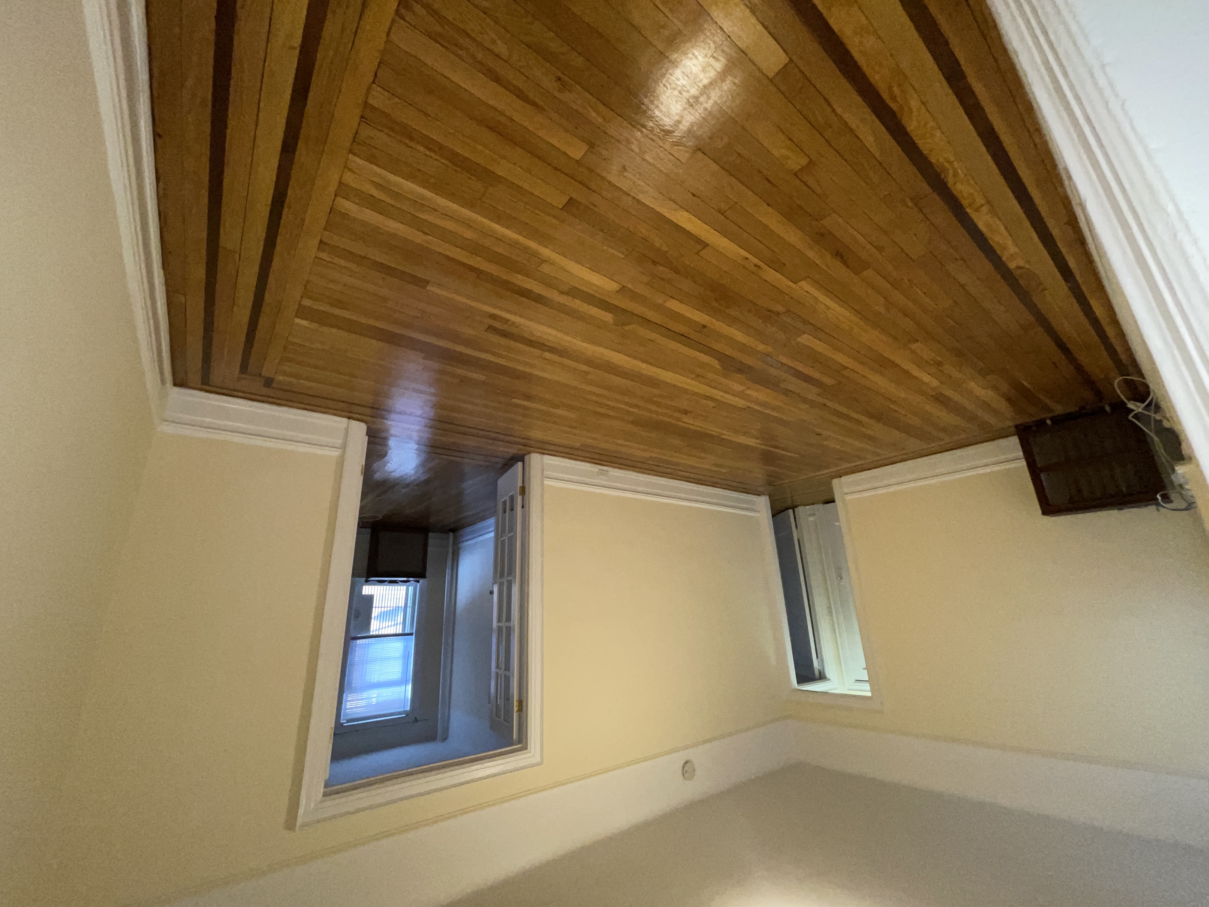 31-74 33rd Street Queens, NY 11106 - Photo 5 of 16 a view of a room with wooden floor and chair