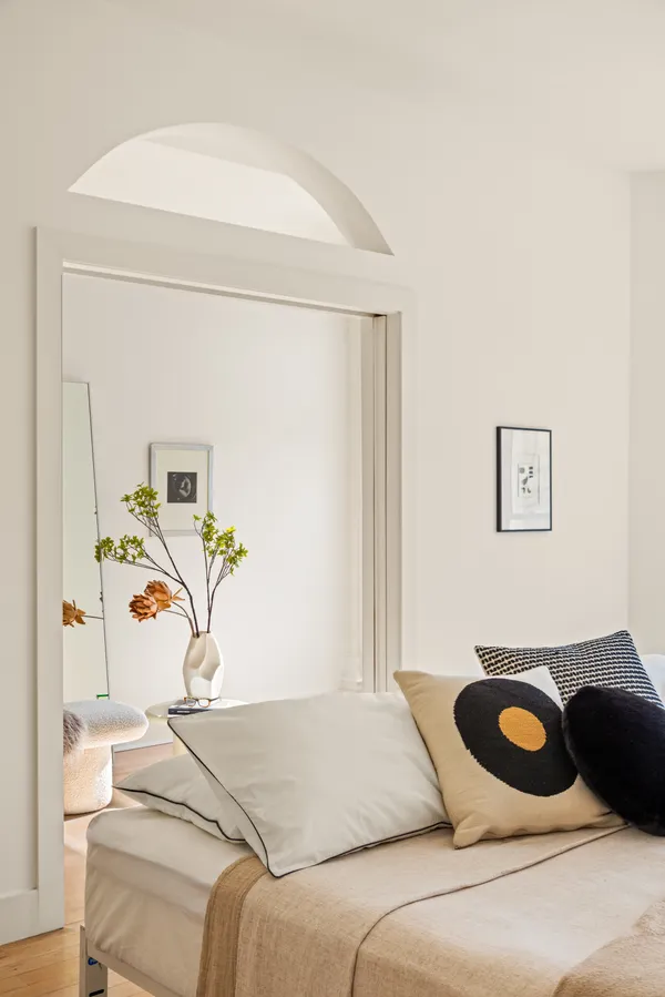 a bedroom with a bed and ceiling fan