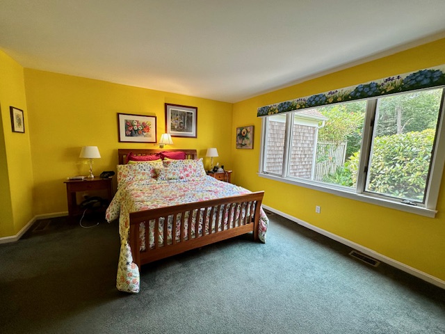 11 Juniper Circle Brewster, MA 02631 - Photo 8 of 29 a bedroom with a bed and wooden floor