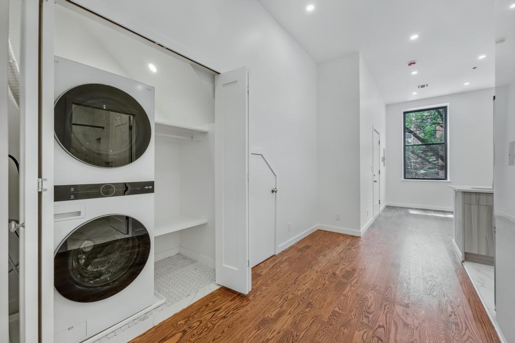 109 President Street, Unit 2 Brooklyn, NY 11231 - Photo 11 of 20 a view of a hallway with washer and dryer