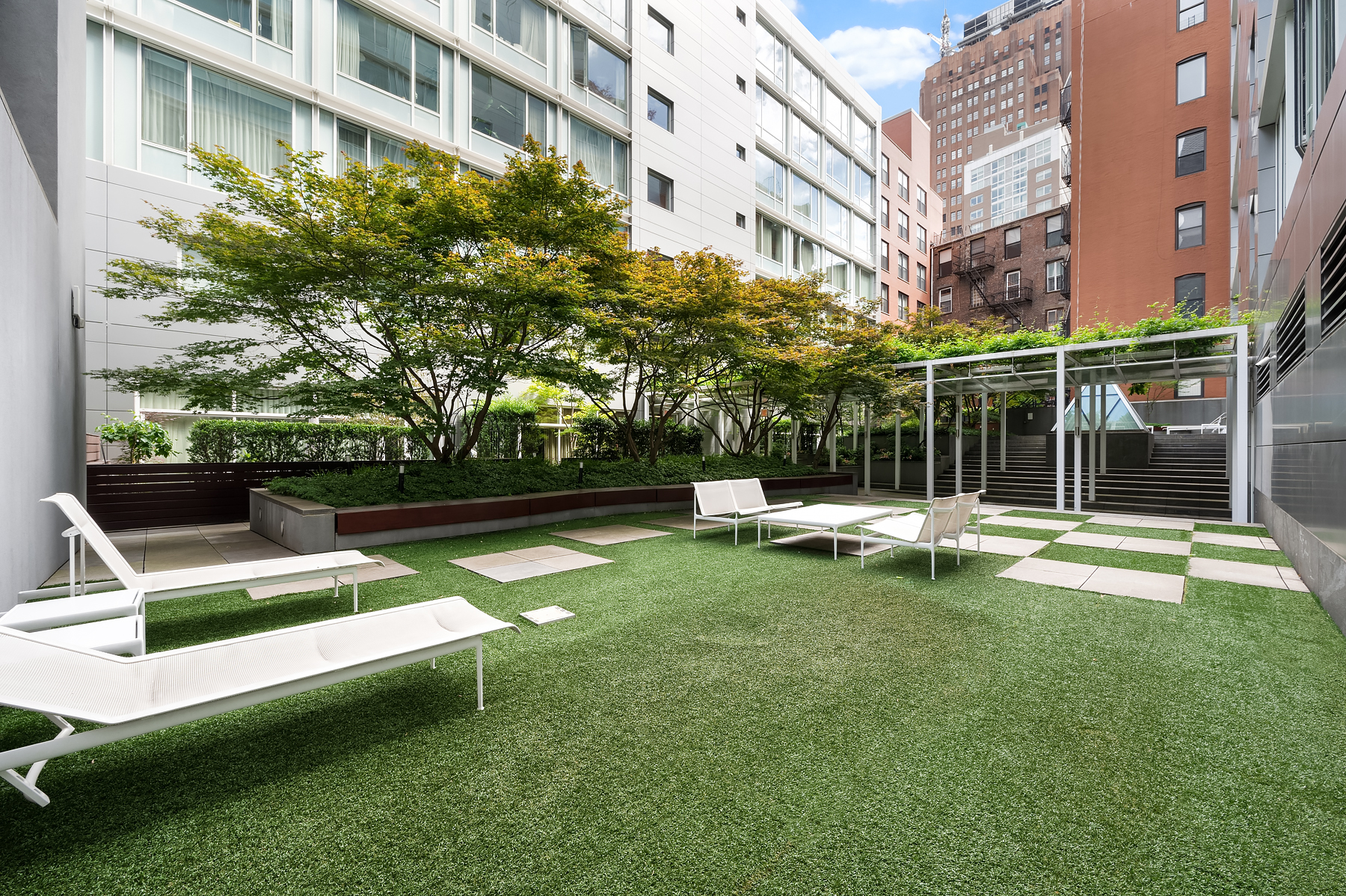311 West Broadway, Unit 4G Manhattan, NY 10013 - Photo 7 of 8 a view of a house with backyard porch and sitting area