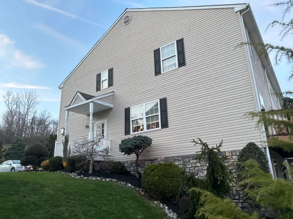 a front view of a house with a yard