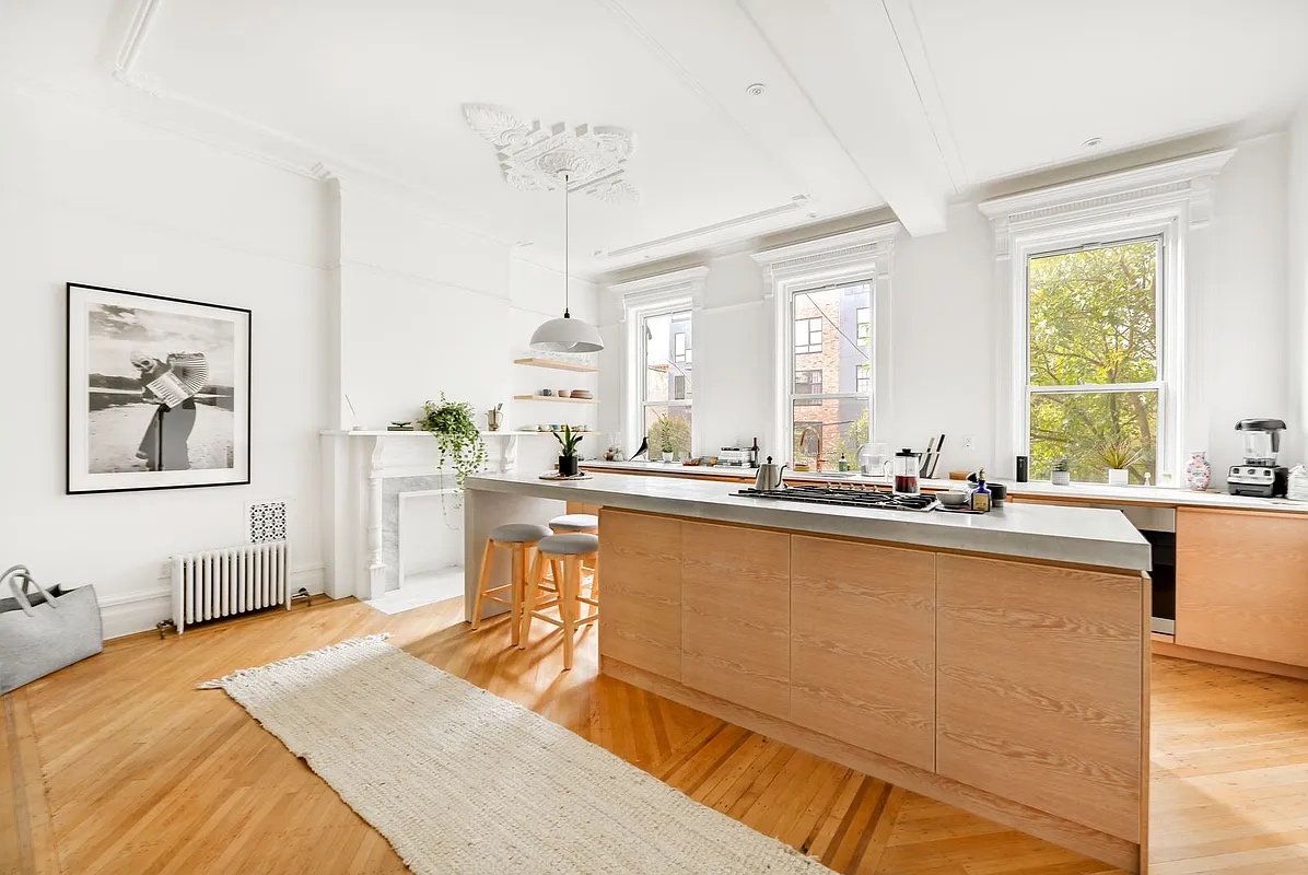 611 Macon Street Brooklyn, NY 11233 - Photo 2 of 12 a large white kitchen with a large window