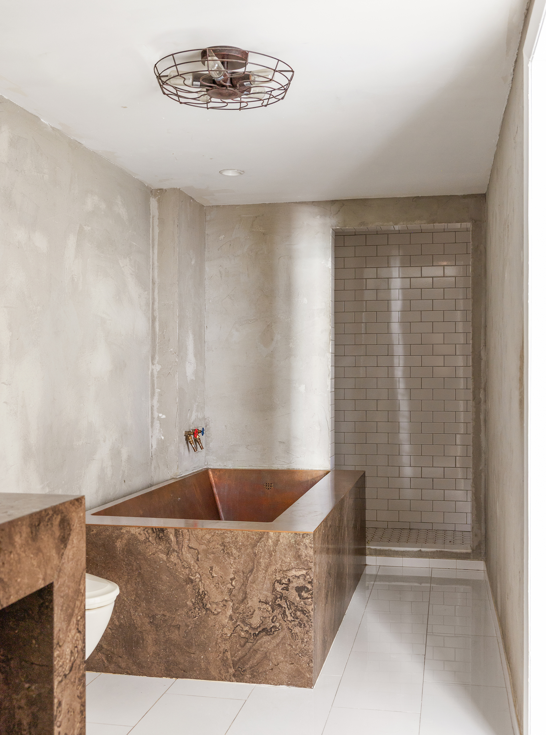 49 Howard Street, Unit 4S Manhattan, NY 10013 - Photo 8 of 12 a bathroom with a bathtub