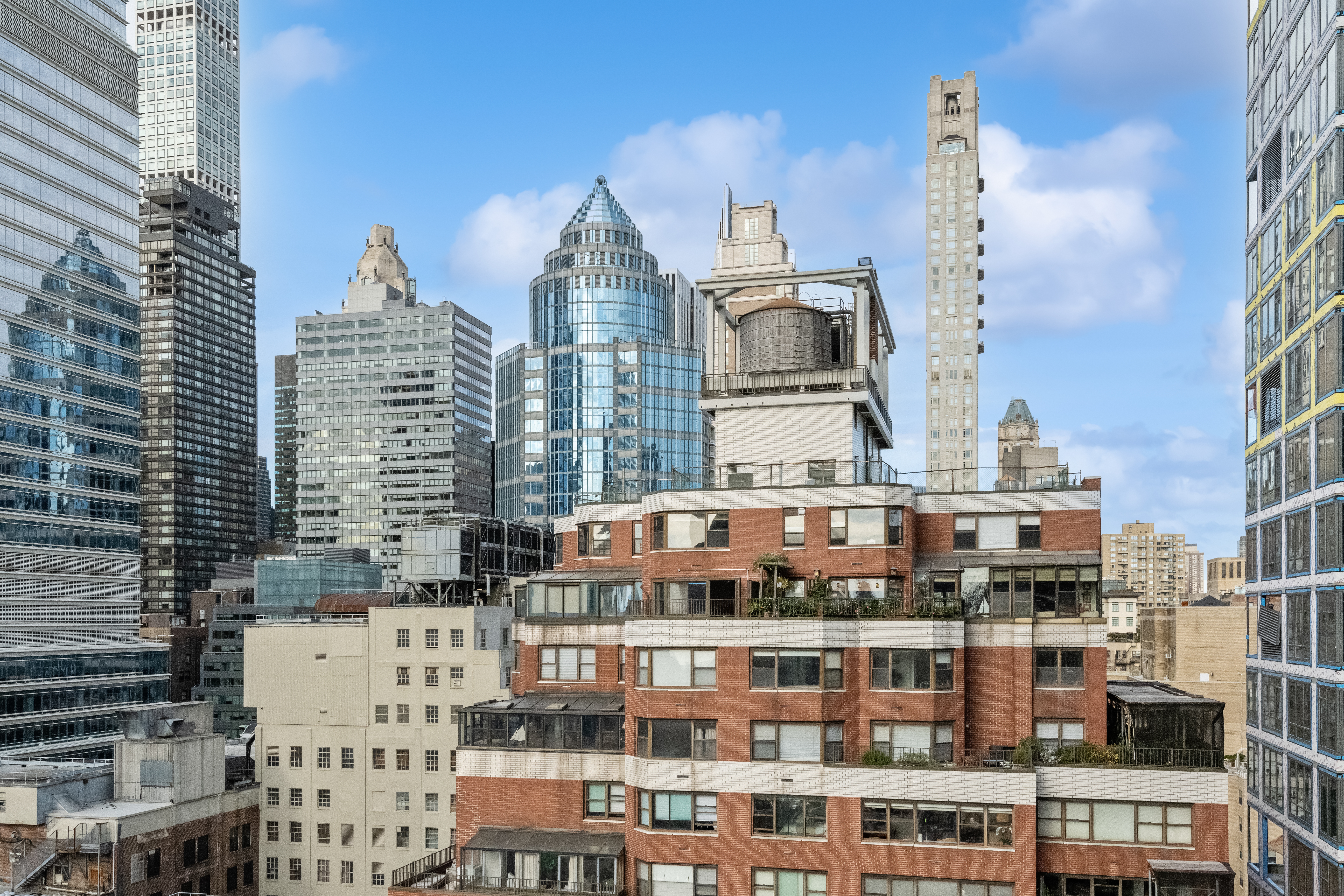 200 East 61st Street, Unit 18A Manhattan, NY 10065 - Photo 8 of 9 a view of a tall building with a city street