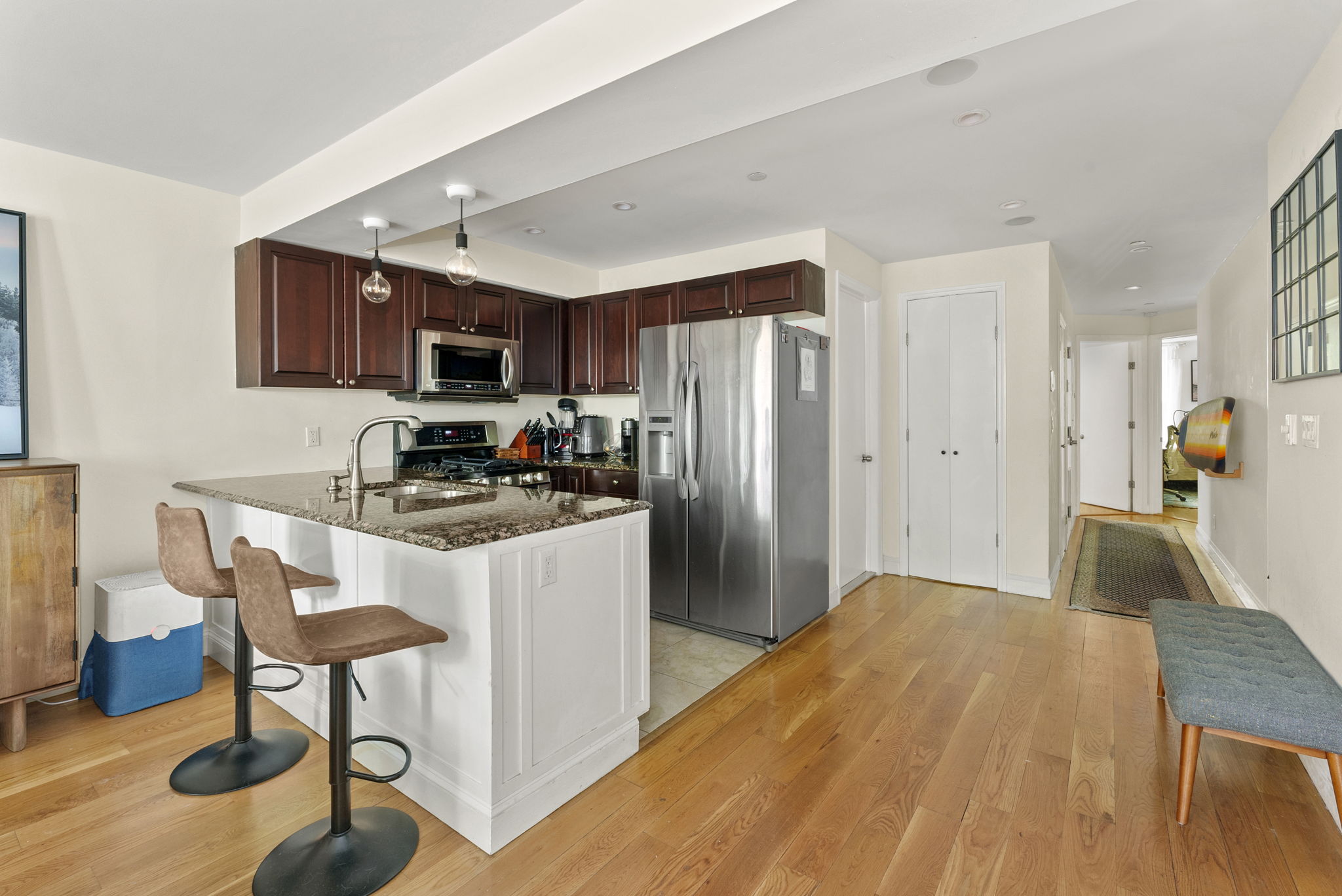 54 State Street, Unit 5 Brooklyn, NY 11201 - Photo 4 of 9 a kitchen with stainless steel appliances granite countertop a refrigerator and a stove top oven