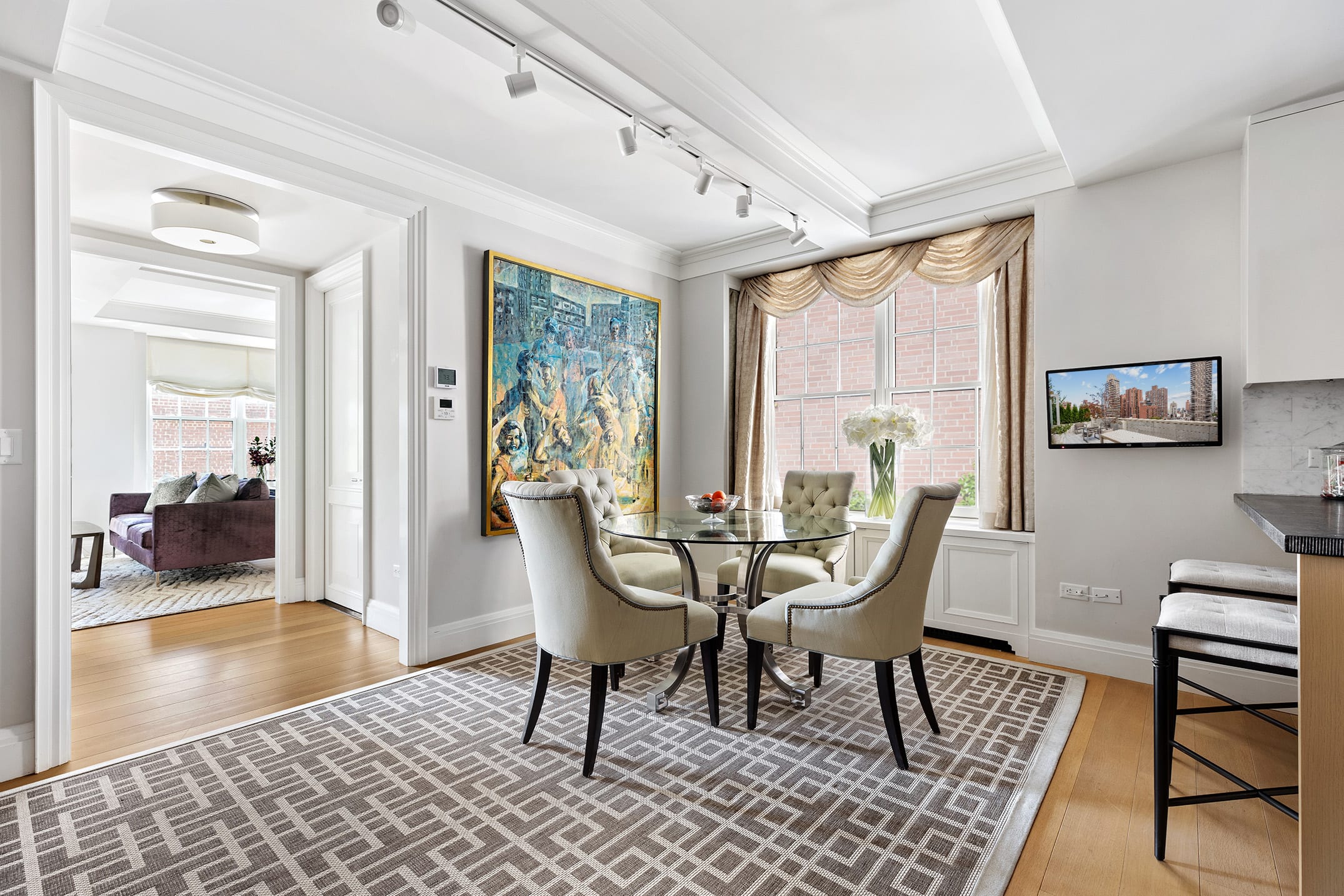 141 East 88th Street, Unit 7A Manhattan, NY 10128 - Photo 2 of 16 a dining room with furniture and wooden floor