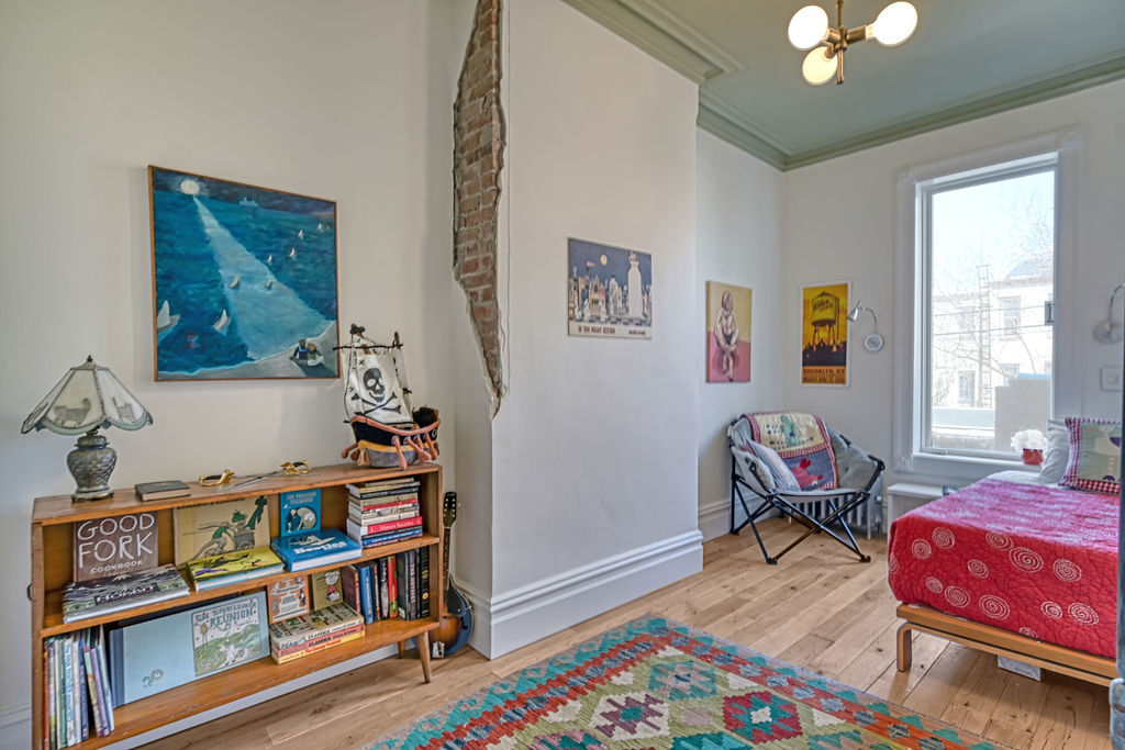 315 15th Street Brooklyn, NY 11215 - Photo 15 of 25 a bedroom with furniture and a book shelf