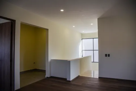 a hallway with a view of living room