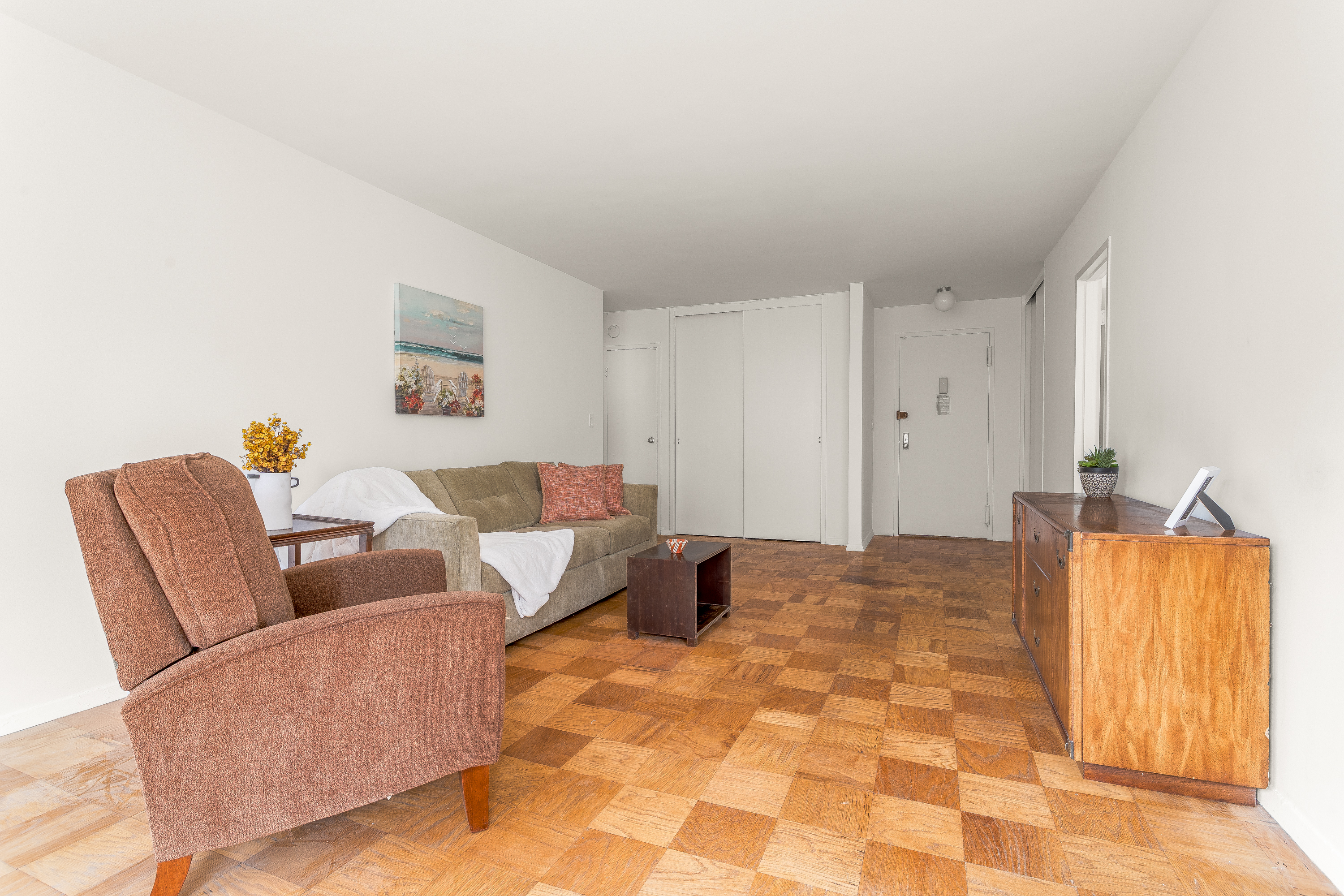 180 West End Avenue, Unit 5H Manhattan, NY 10023 - Photo 4 of 18 a living room with furniture and a couch