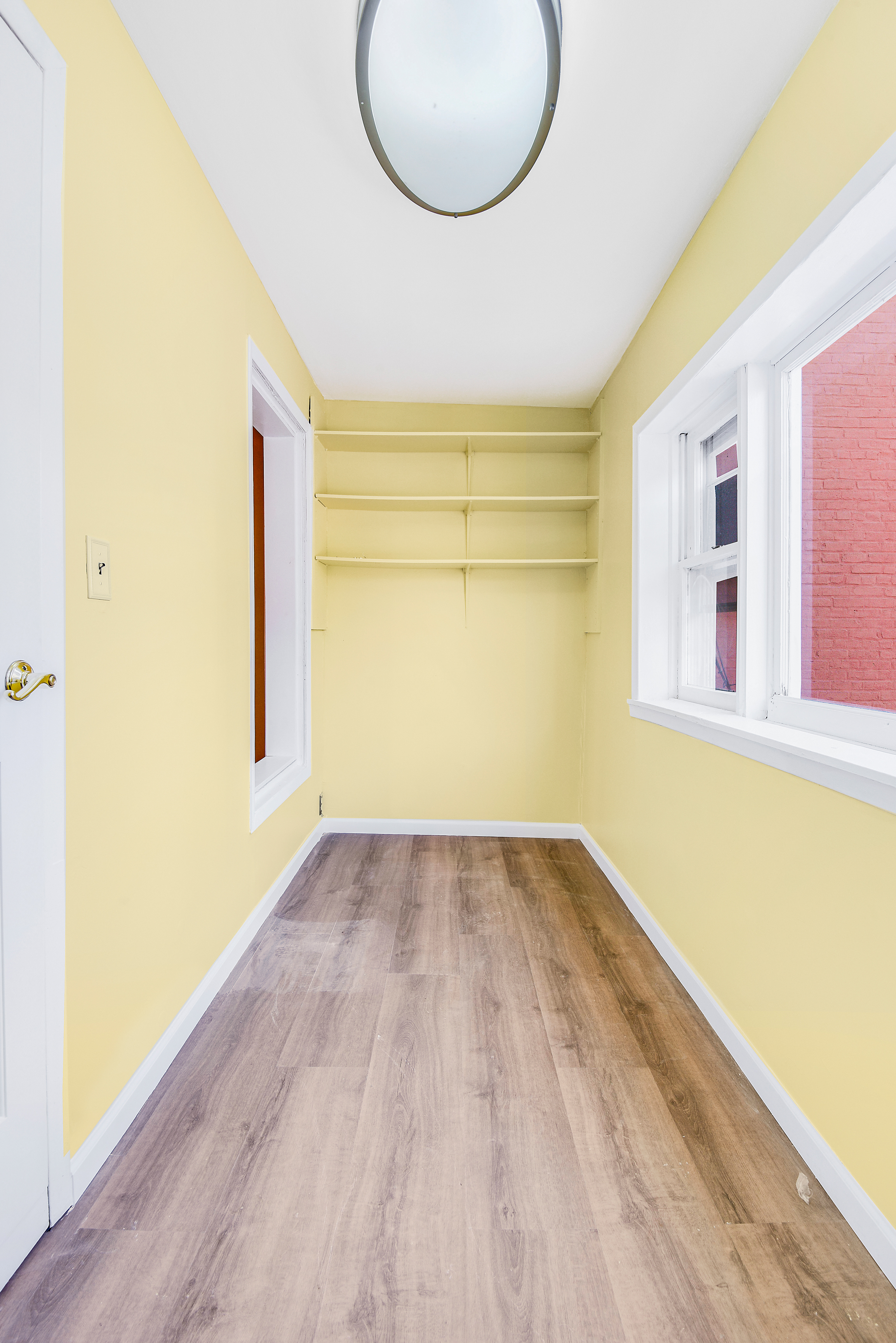 35-47 30th Street, Unit 1 Queens, NY 11106 - Photo 9 of 15 a view of a room with wooden floor and windows