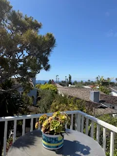 a view of a balcony with furniture